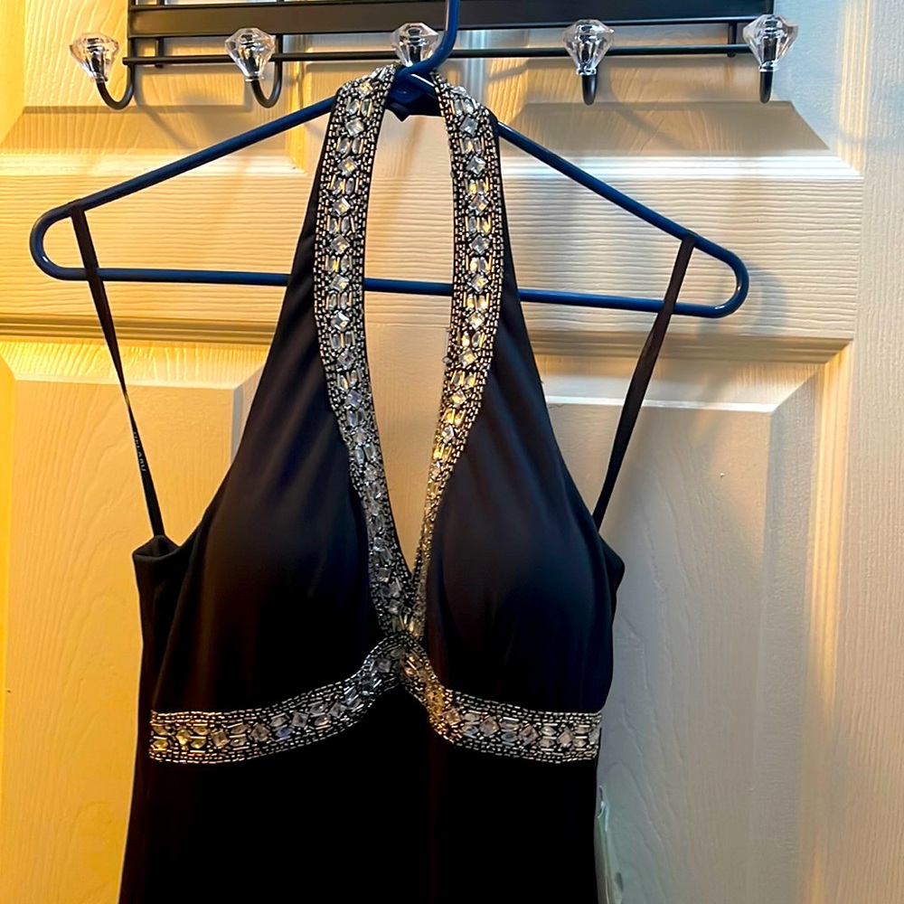 New with tags. Beautiful Black Halter Dress with Beading. Size 7/8.